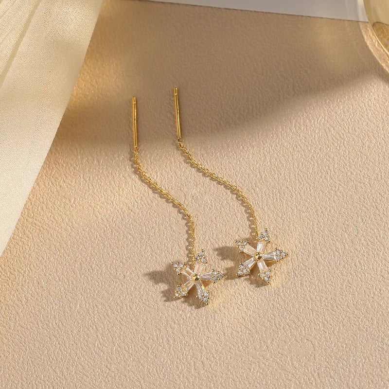 Pendientes largos con borlas, estrellas y corazones